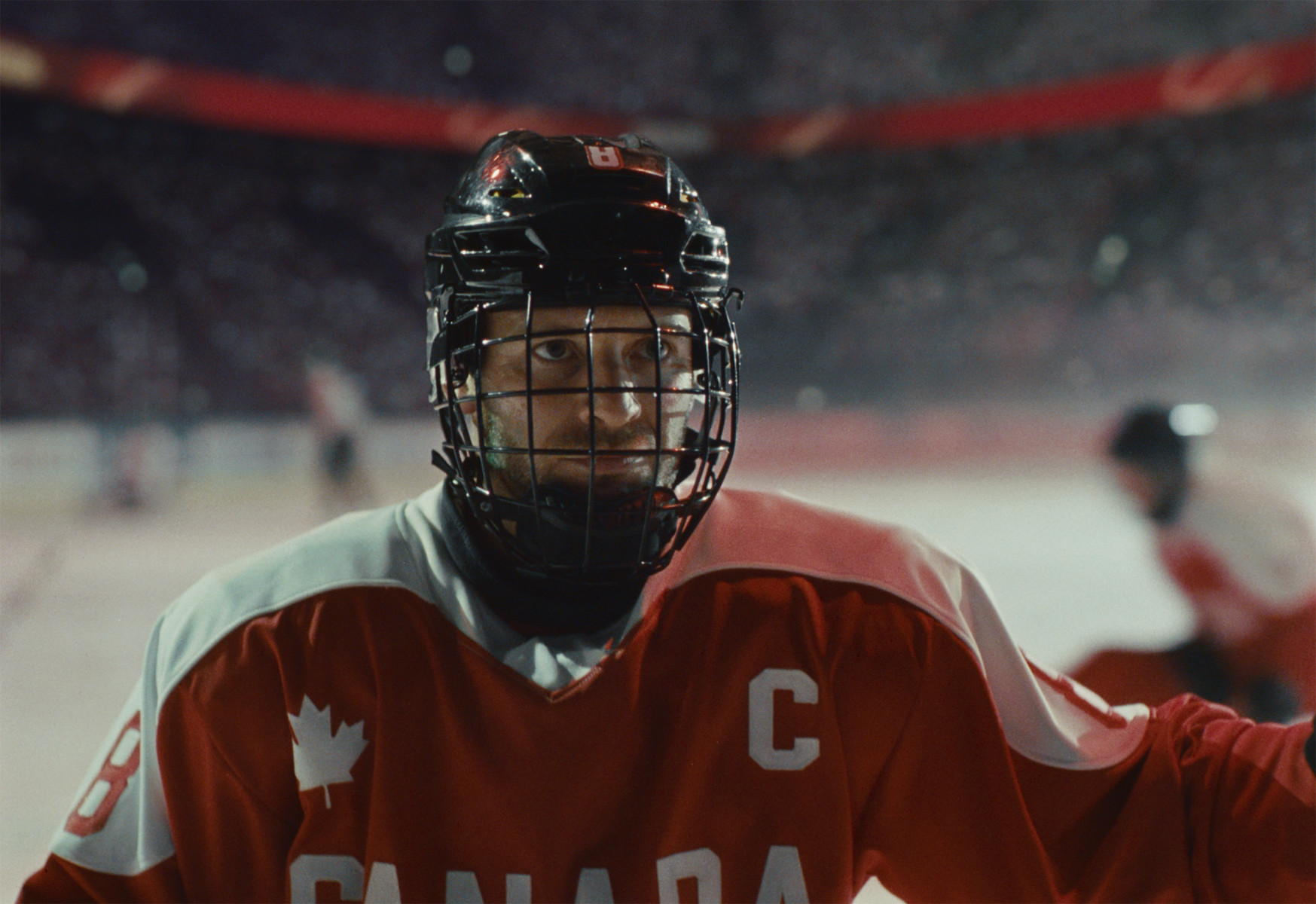 Official Air Canada 2026 #FlyTheFlag brand-spot still showing Paralympian Tyler McGregor in Team Canada para ice hockey gear