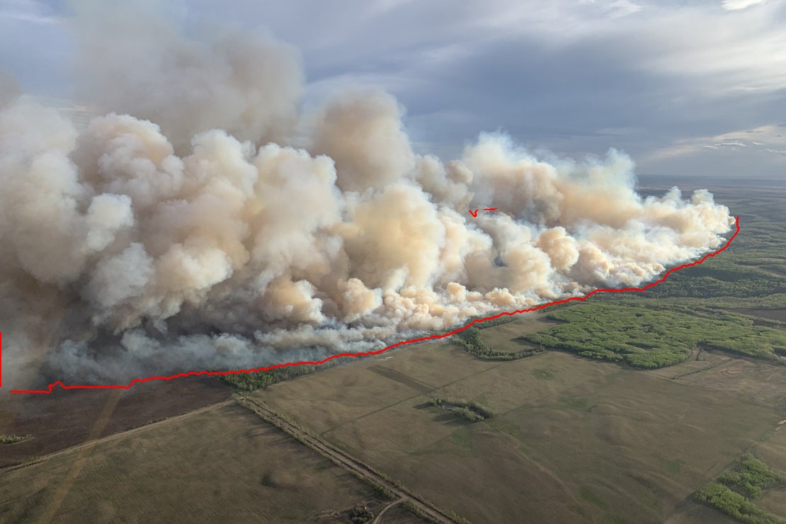 An AI model segments flames and smoke in aerial footage.