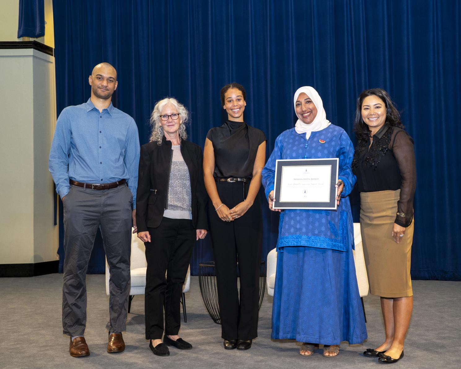 Shireen Ahmed receives the Carl Mitchell Community Impact Award.