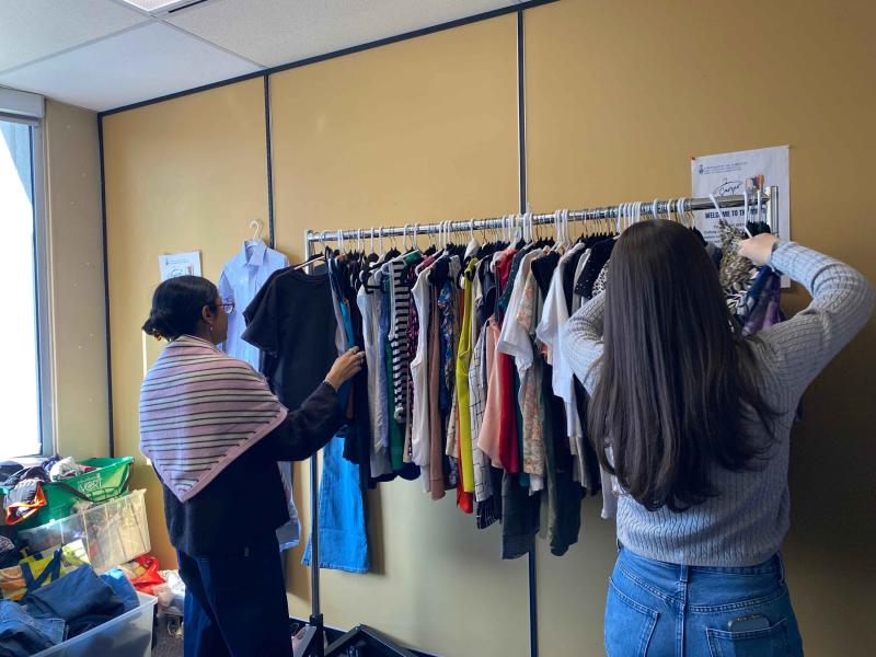 OISE community members browse donated clothing at the Career Closet.