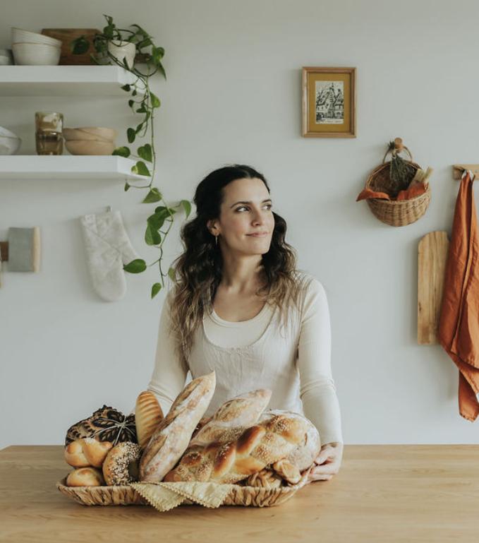 Rachel Pardoe with a basket of sourdough bread.