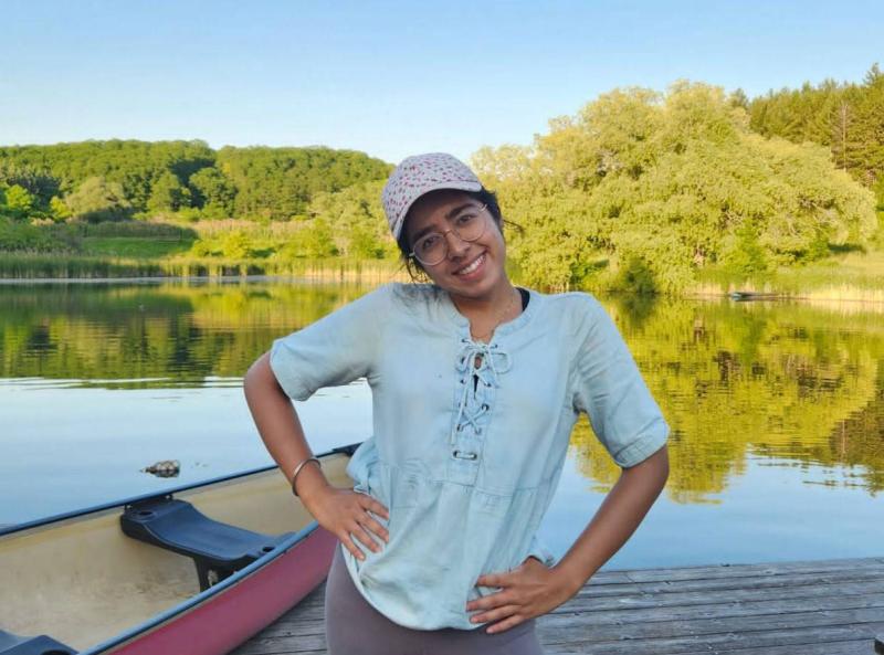 Hargun Rekhi beside the lake at Koffler Scientific Reserve.