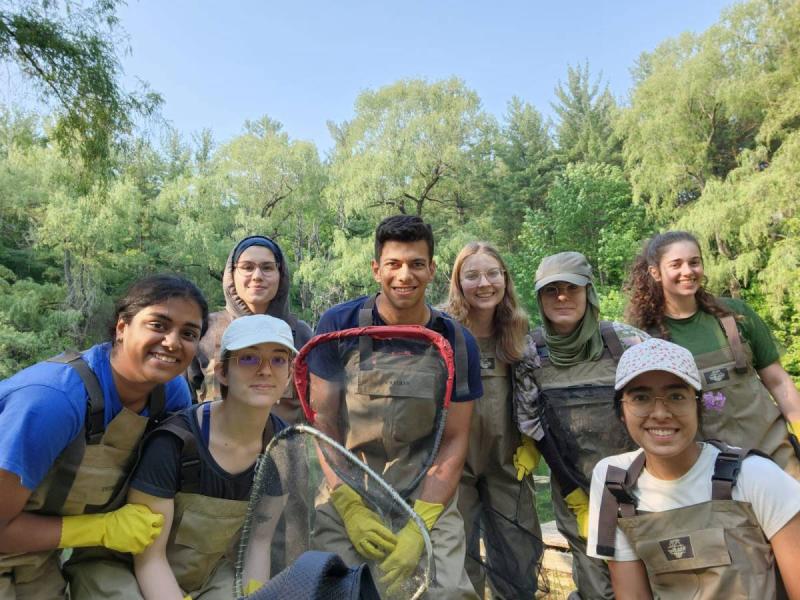 Rekhi, second from right, joins aquatic sampling at Koffler Scientific Reserve in 2023.